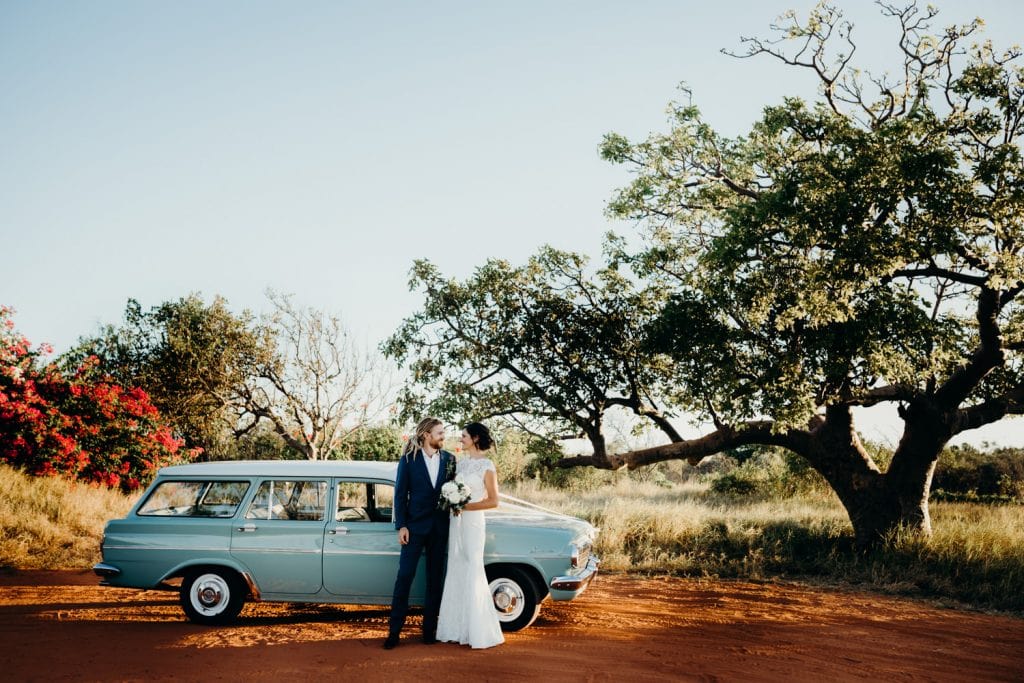 wedding couple with old Holden car and boab tree in the Kimberley