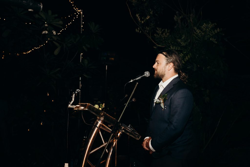 best man gives wedding speech under the stars 