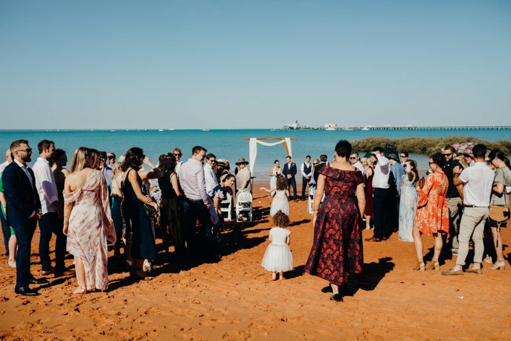 mother of the bride walks down the aisle at beach wedding at Roebuck Bay in Broome