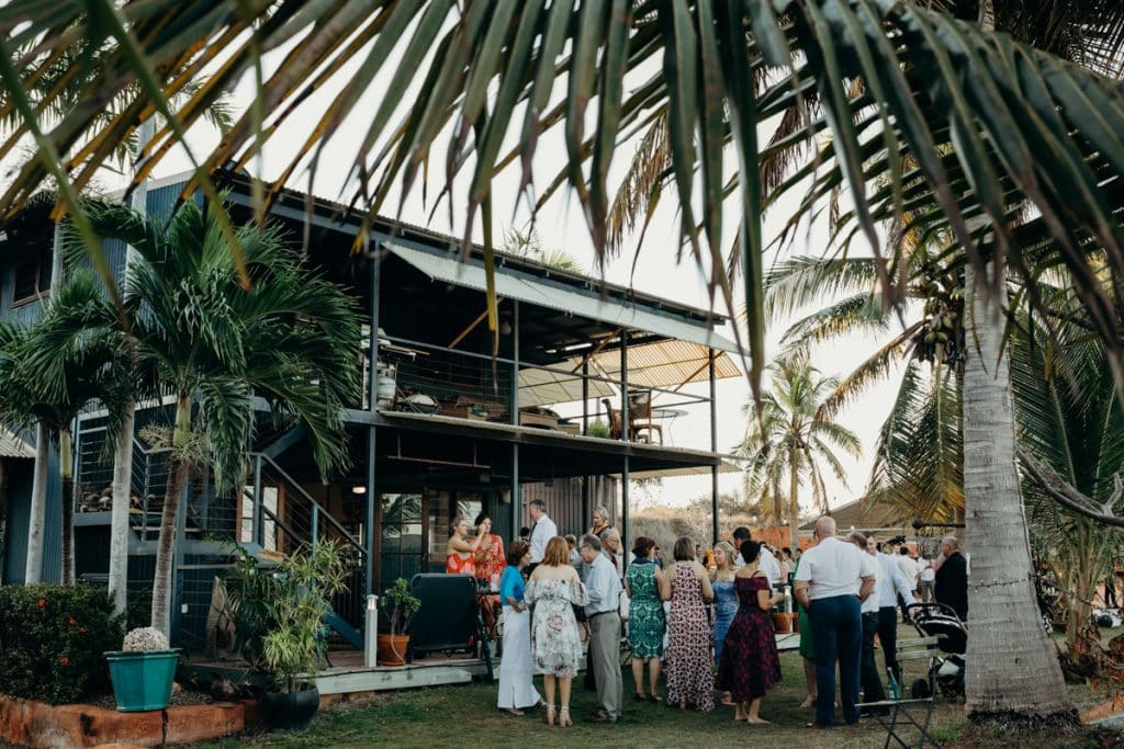 wedding guests mingling at reception venue at Roebuck Bay in Broome
