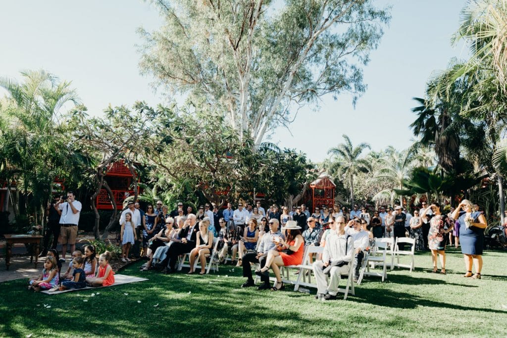 wedding guests are seated at Cable Beach Club gardens