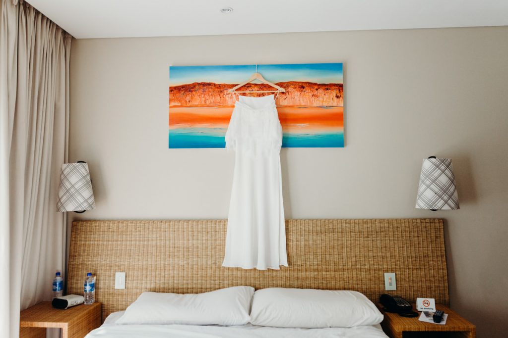 Grace Loves Lace wedding dress hung up in Broome hotel room