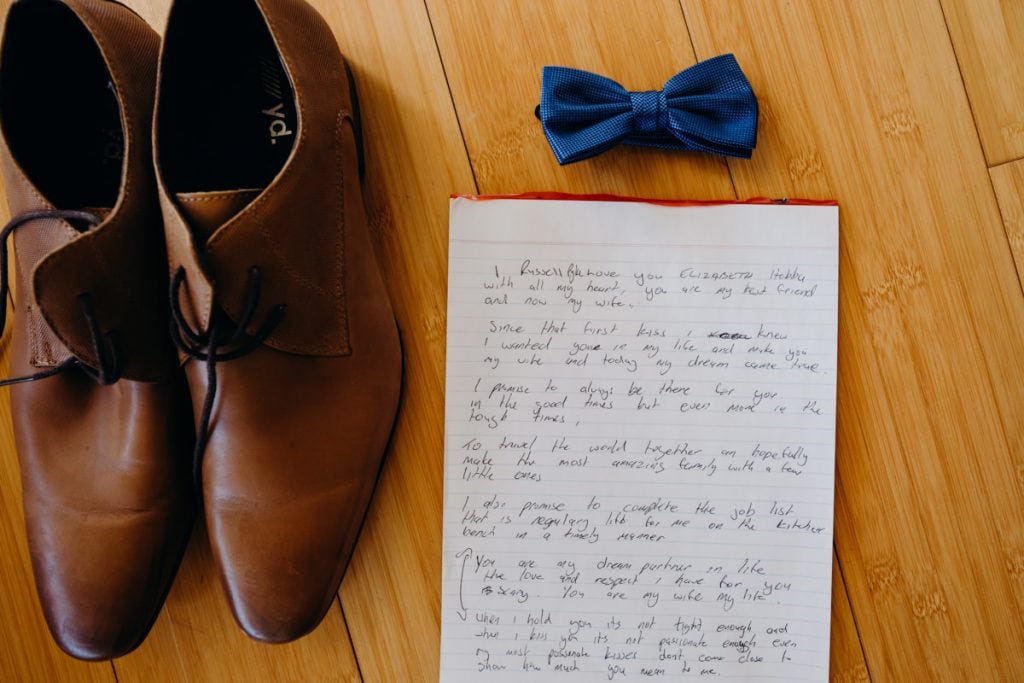 handwritten wedding vows and shoes