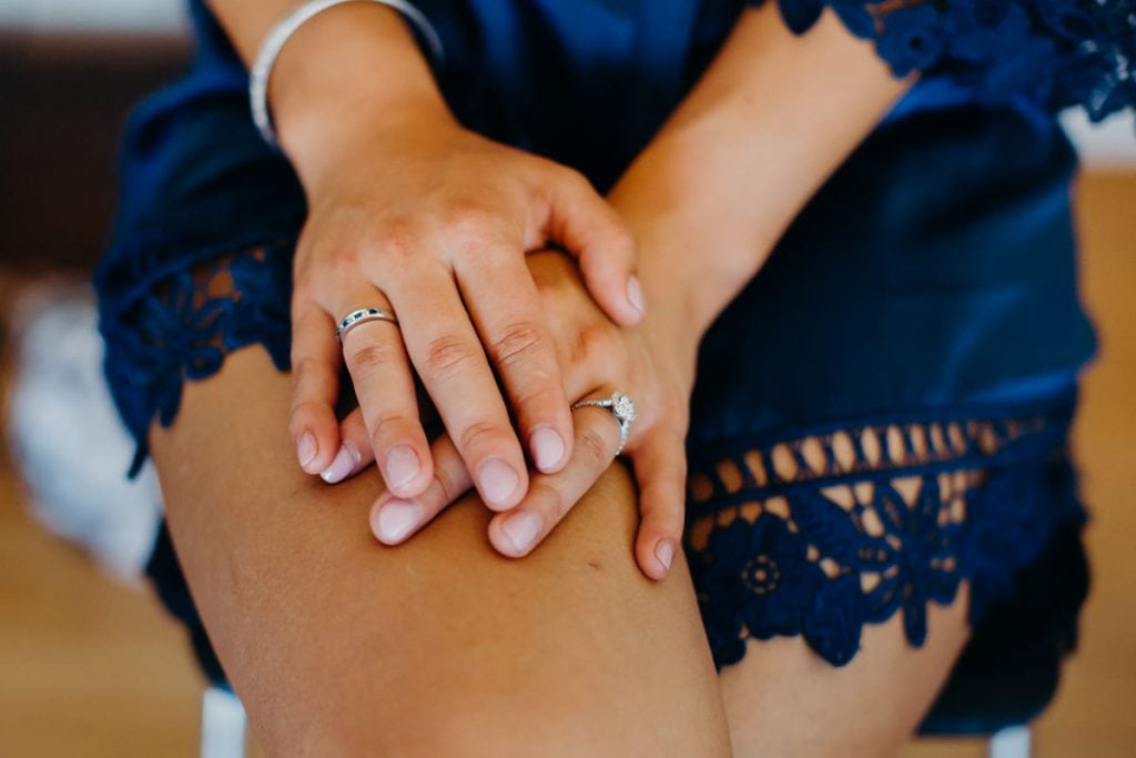 bride's hands with engagement ring