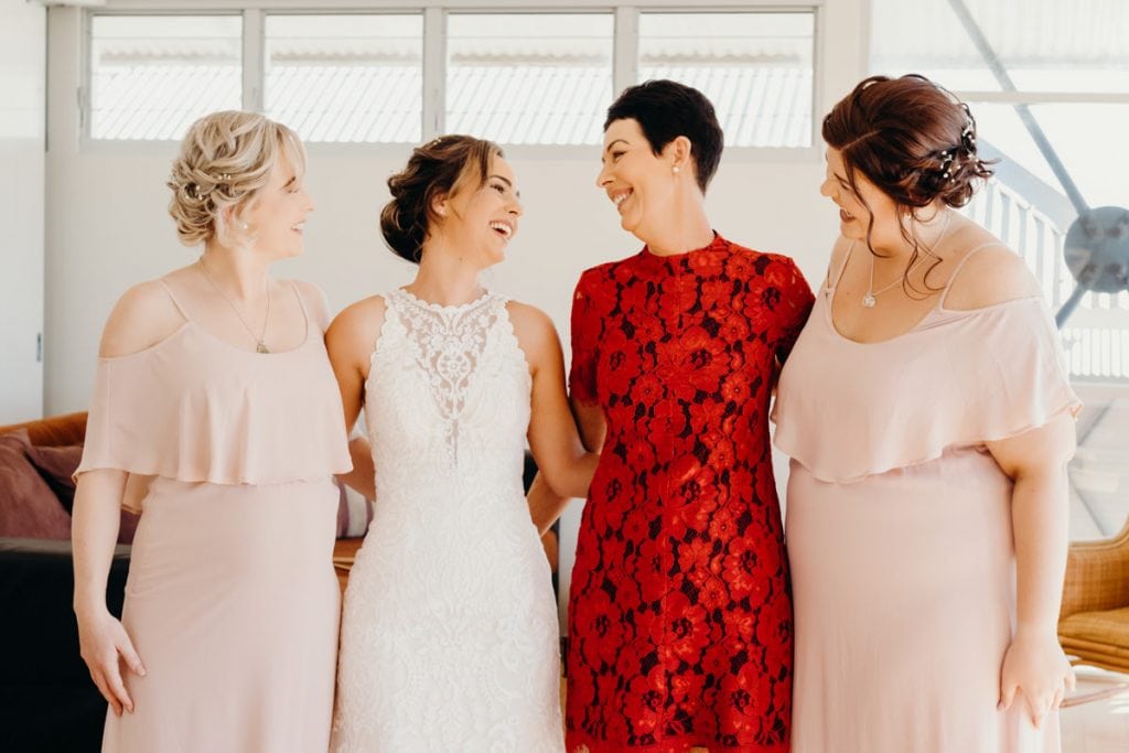 group photo of bride with bridesmaids and mother