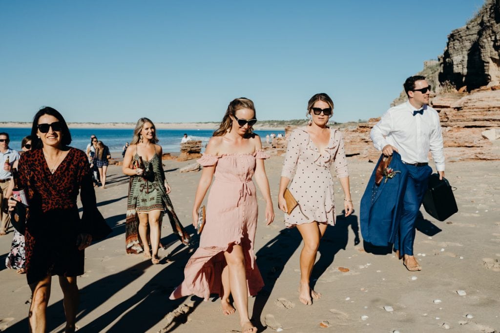 wedding guests barefoot on Eco Beach
