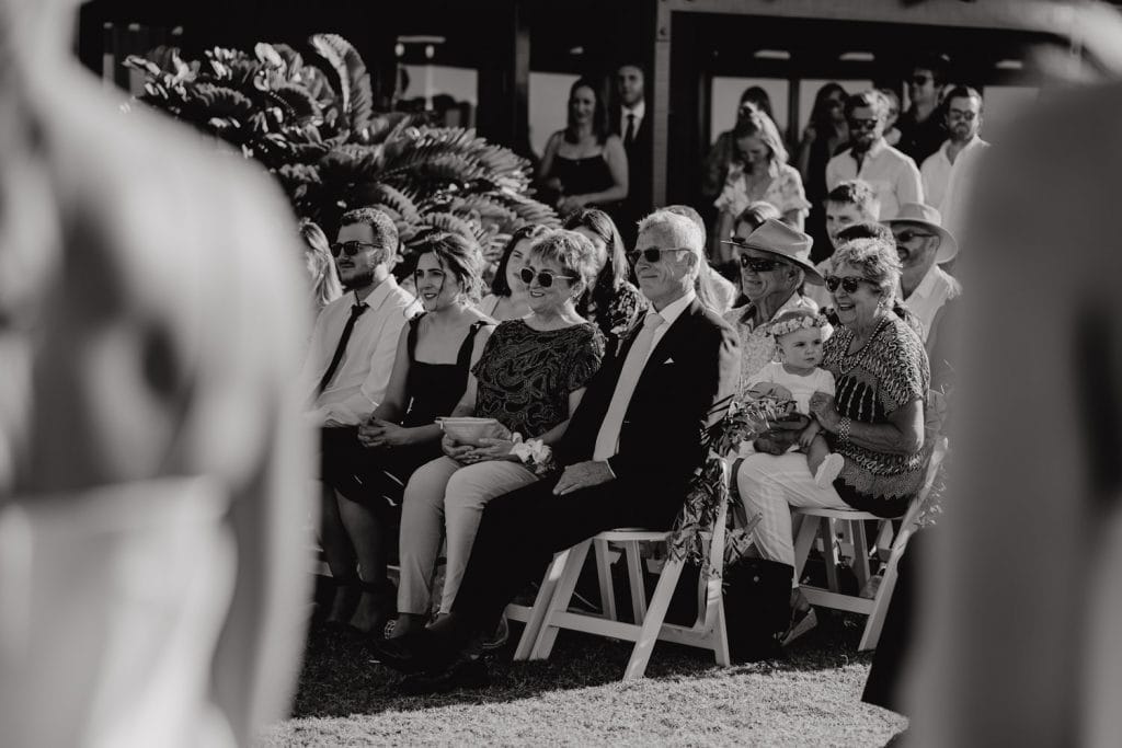 parents of the groom sitting in the first row during wedding ceremony at Gnarangannie