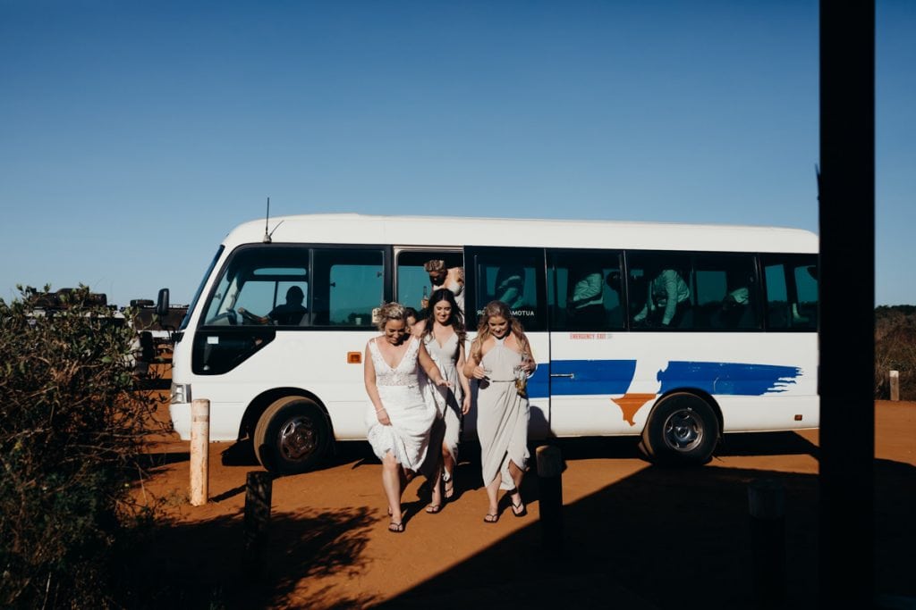 Bridal party steps out at town bus at Gantheaume Point on Broome wedding