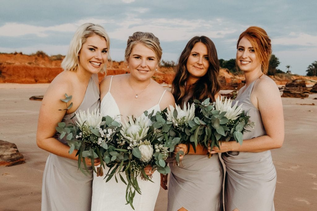bridesmaids with beautiful flower bouquets
