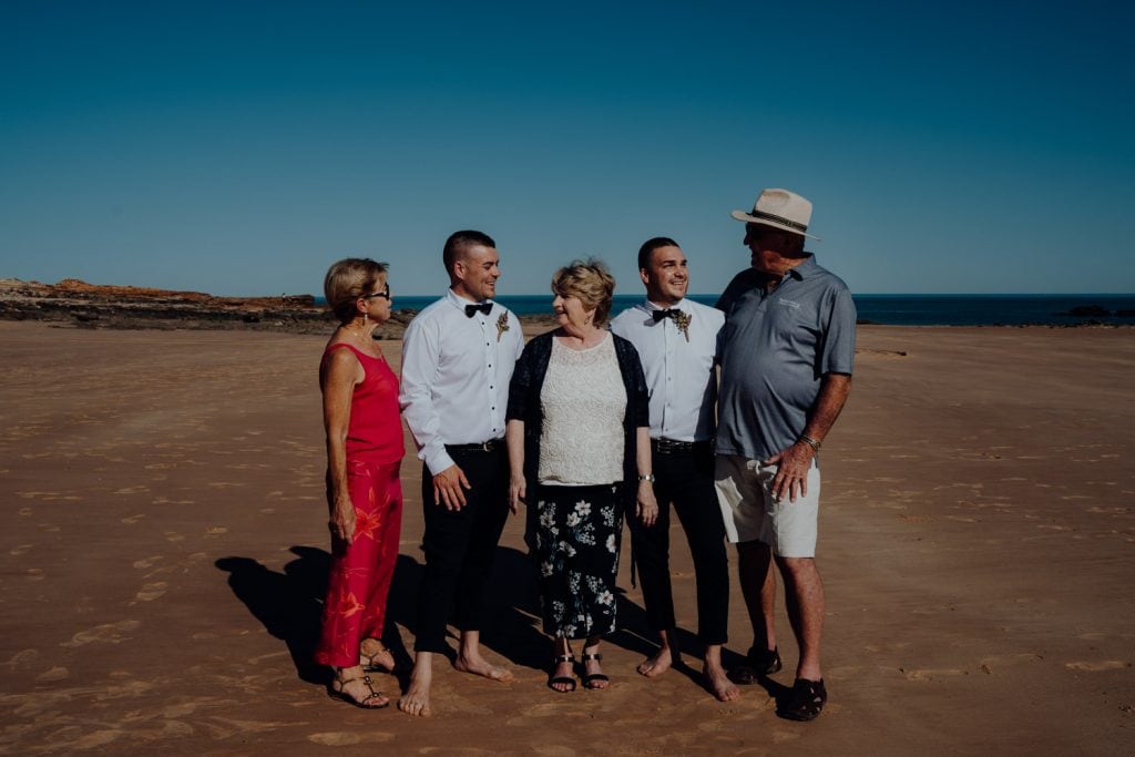 family group photo with groom at relaxed beach wedding at Entrance Point