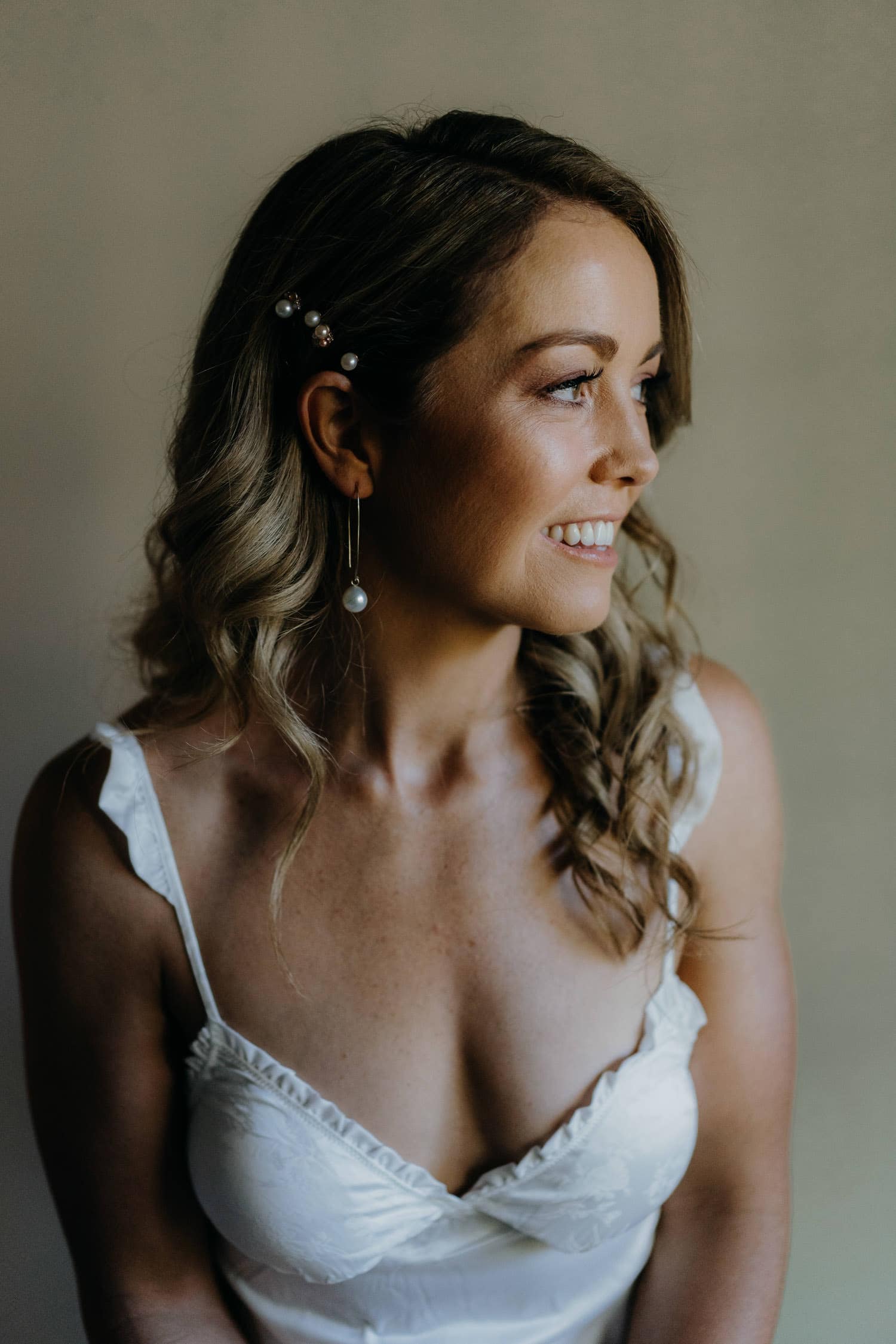 portrait of a young bride with pearl earnings 