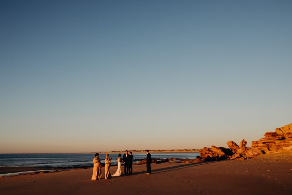 bridal party in golden light on Eco Beach