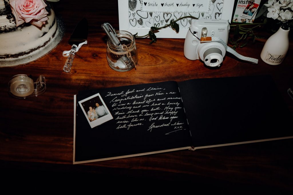 guest book at wedding with polaroid camera 